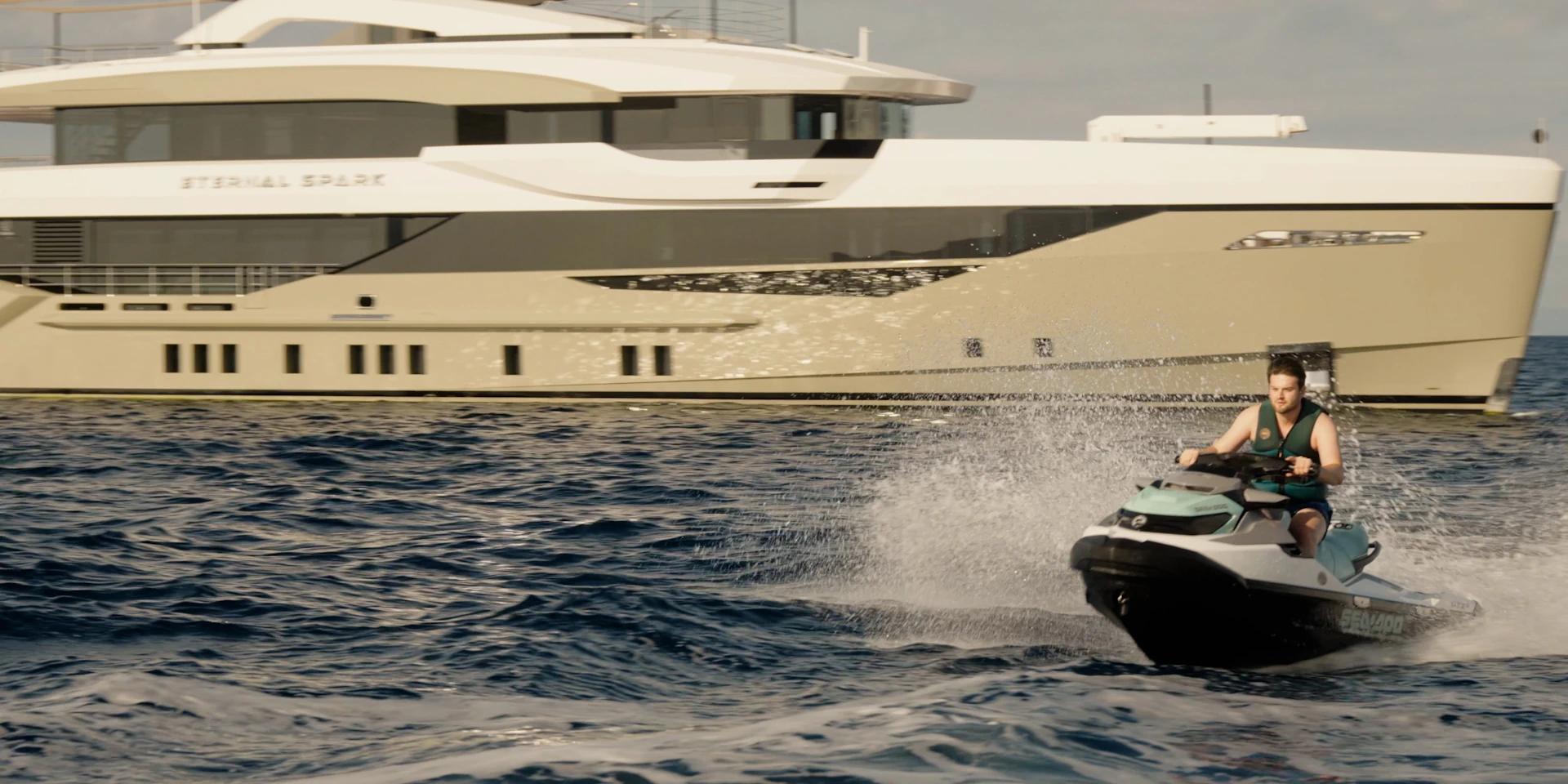 riding a jet ski in front of eternal spark